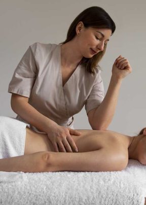 65a1aaa7cce875af806df335_woman-getting-back-massage-from-female-masseur-header